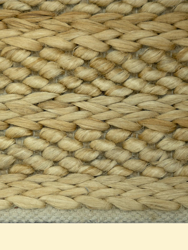 Golden Dune | Handwoven Pitloom Jute Rug, Close-up of a woven natural jute bag with a beige color border