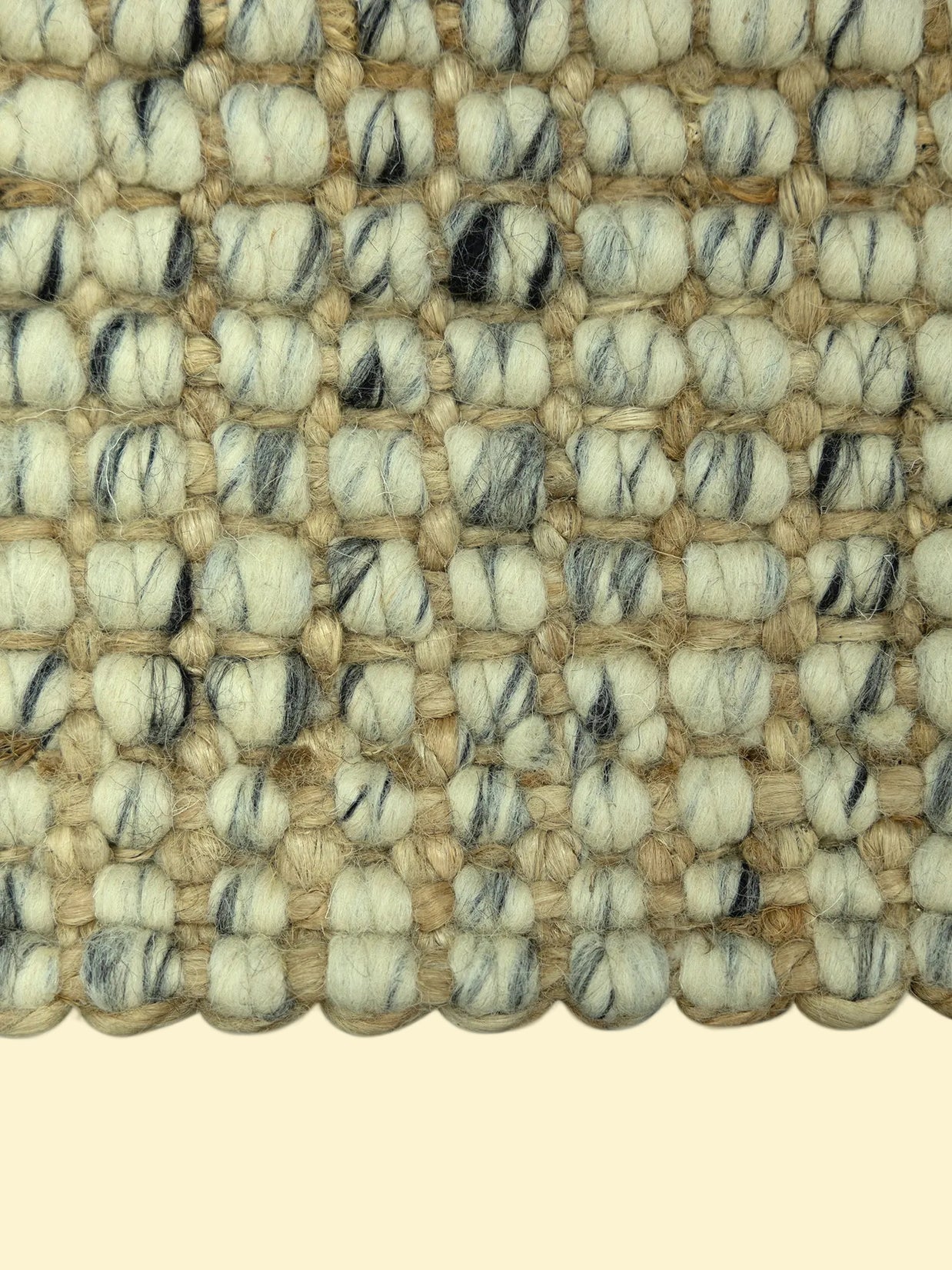 Handmade Durry Pitloom Wool Jute Rug, Close-up of a textured woven jute rug with beige nd black