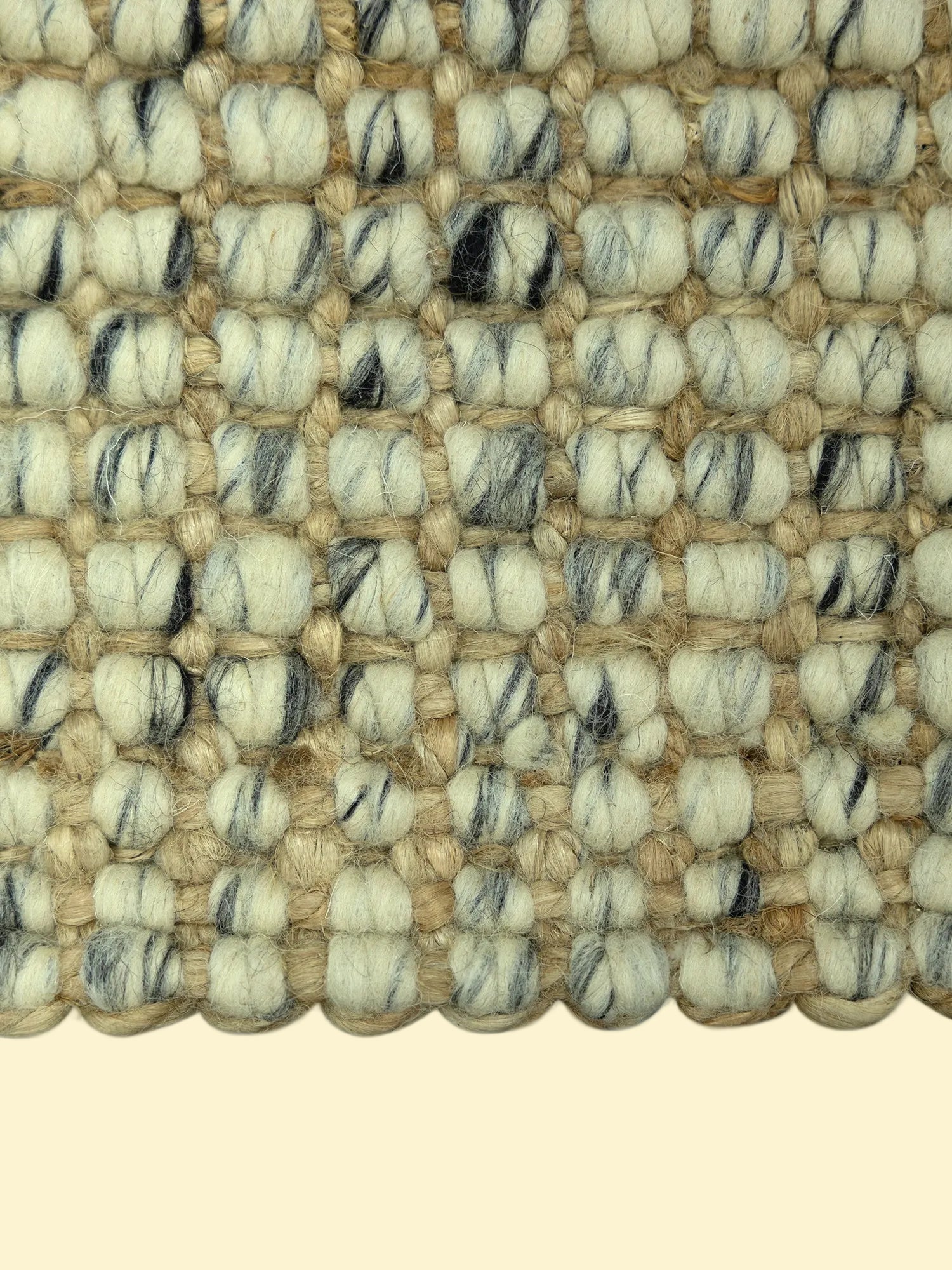 Handmade Durry Pitloom Wool Jute Rug, Close-up of a textured woven jute rug with beige nd black