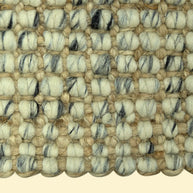 Handmade Durry Pitloom Wool Jute Rug, Close-up of a textured woven jute rug with beige nd black