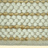Ivory Pebble | Handwoven Pitloom Durrie, Close-up of a textured jute and wool rug with white and beige pattern