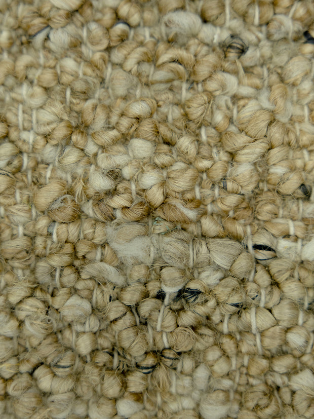 Nomad Texture | Handwoven Pitloom Durrie, Close-up of beige jute carpet texture