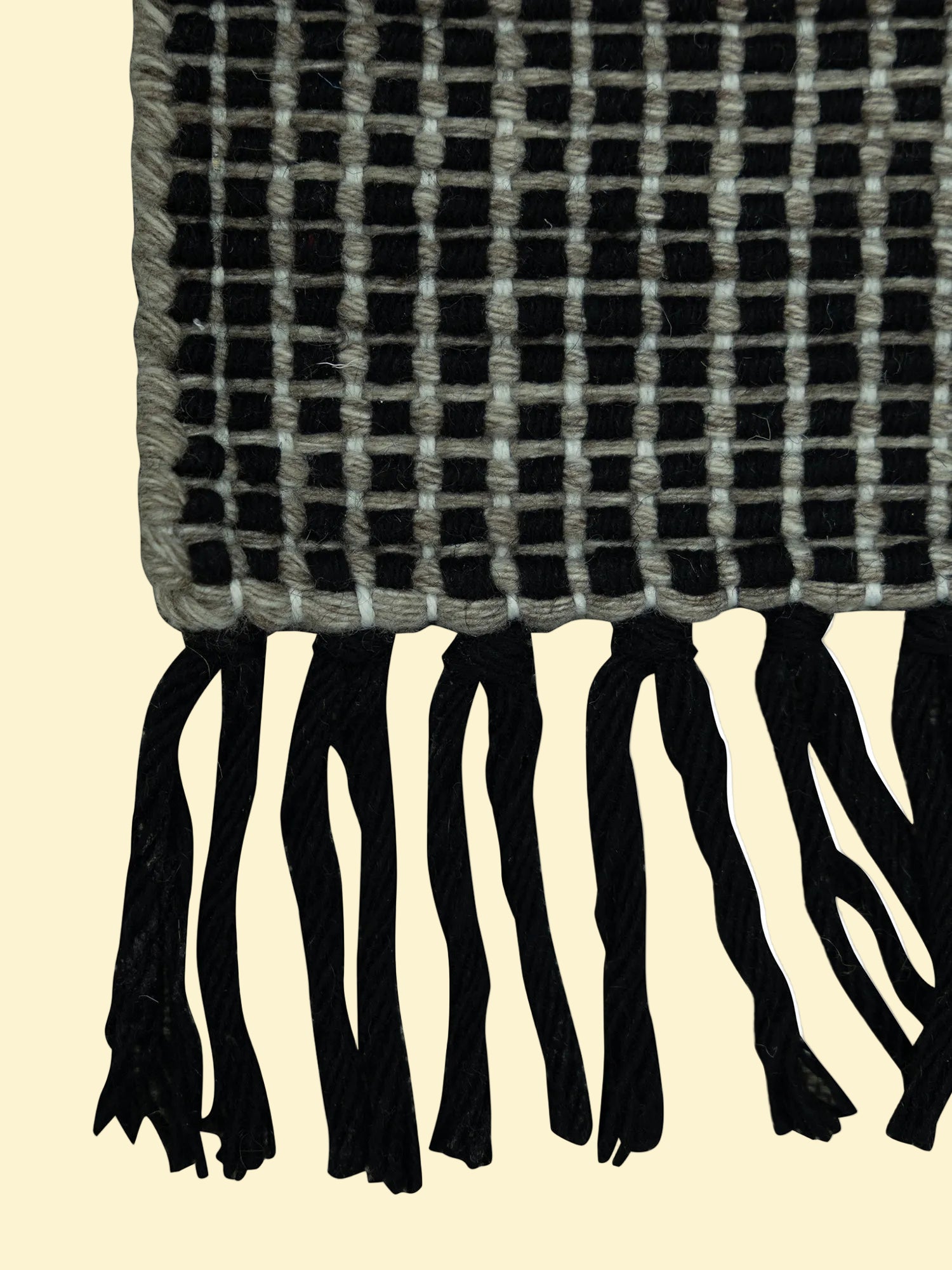 Outdoor_Handwoven_Pitloom_Durrie Corner, Black and gray plaid pet yarn rug with tassels