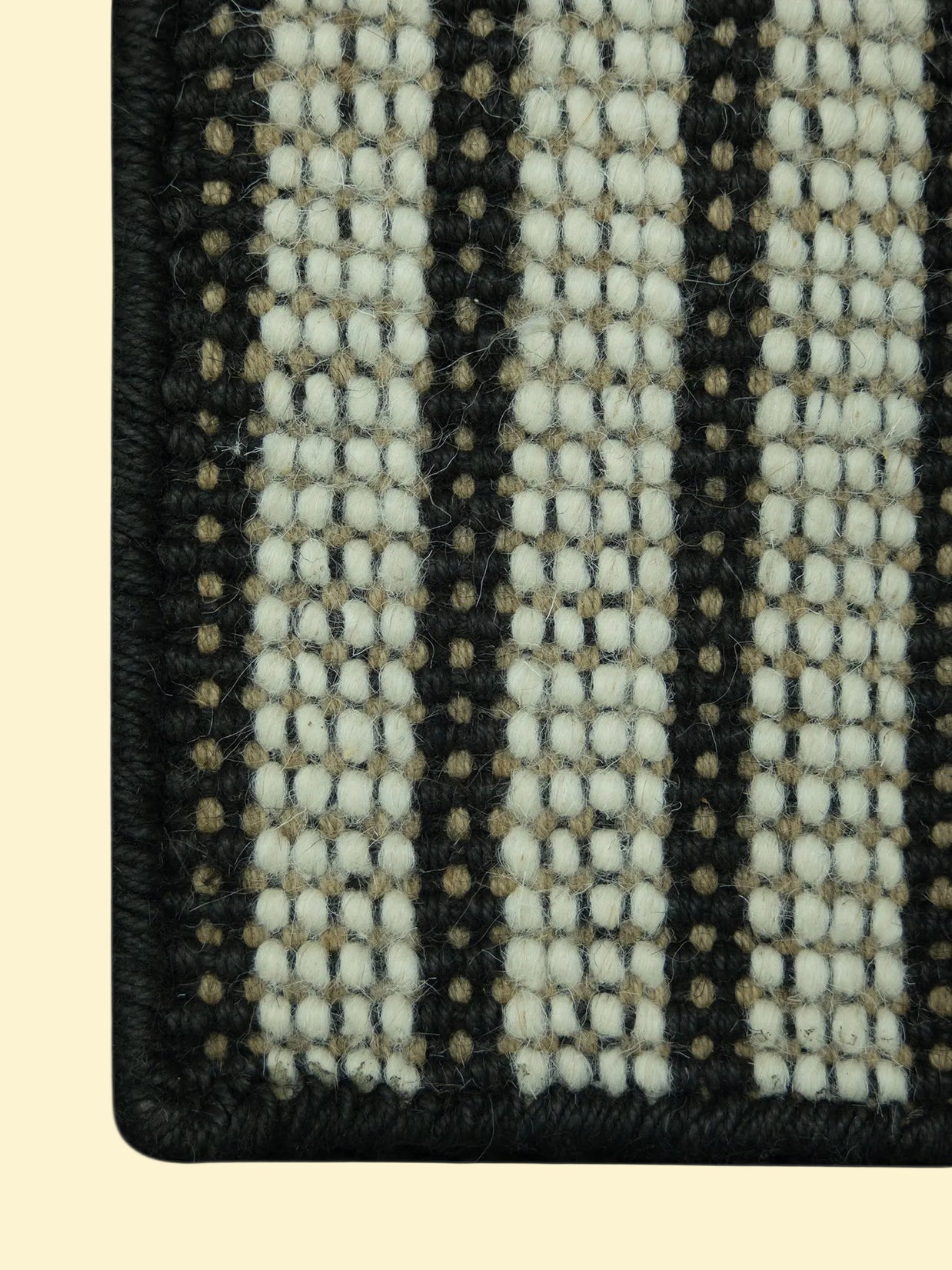 Pitloom Handwoven Wool Jute Rug, Close-up of texture with black and beige