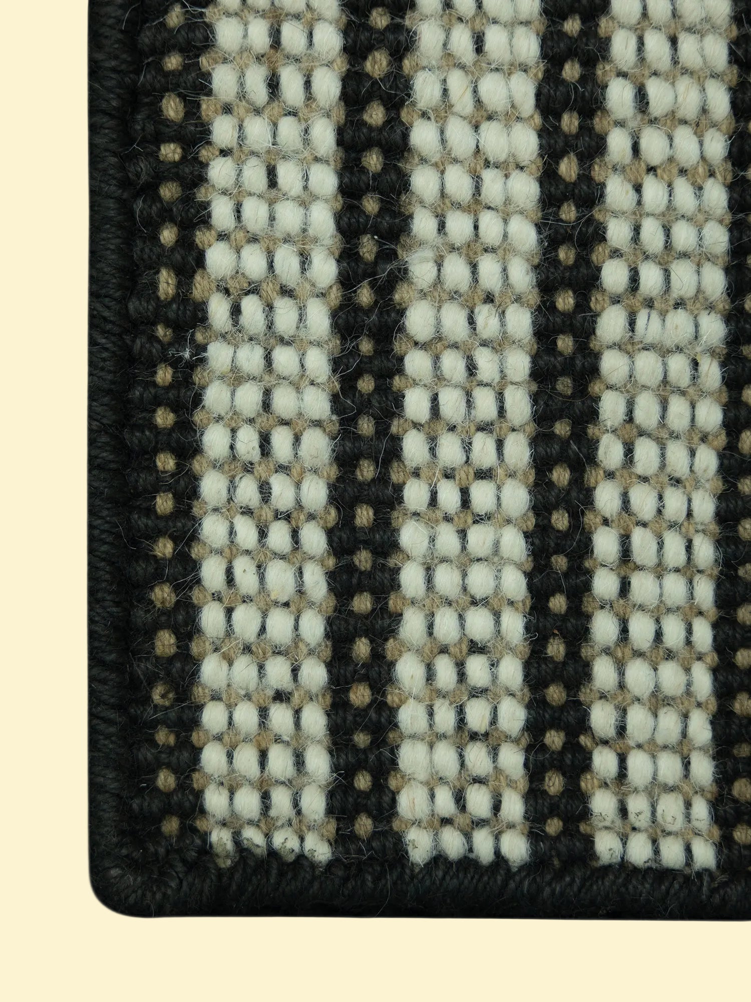 Pitloom Handwoven Wool Jute Rug, Close-up of texture with black and beige