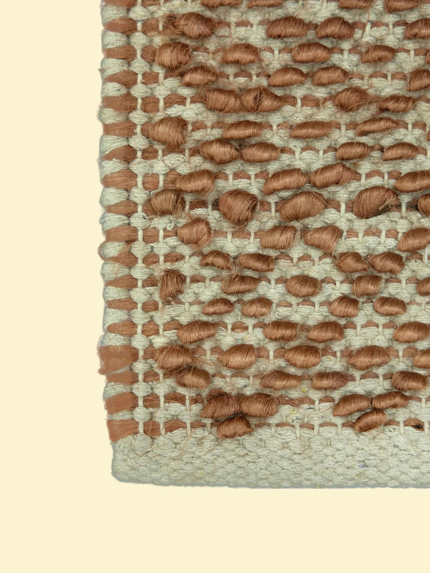 Terracotta Pebble | Handwoven Pitloom Durrie, Close-up of a woven jute and wool rug with brown and beige pattern