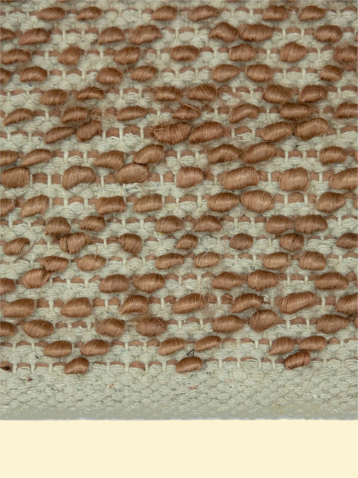 Terracotta Pebble | Handwoven Pitloom Durrie, Textured brown fabric pattern on a jute and wool rug