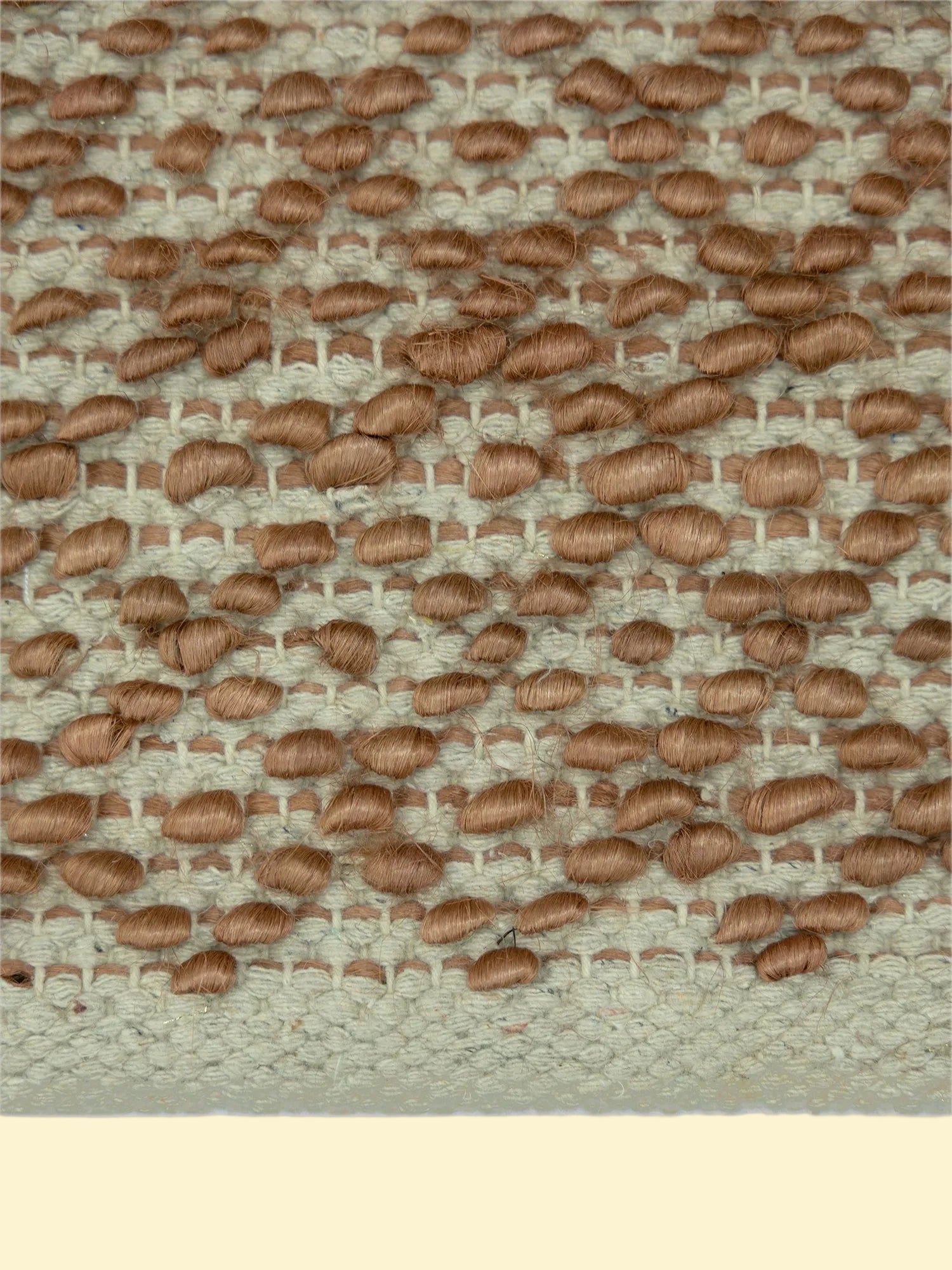 Terracotta Pebble | Handwoven Pitloom Durrie, Textured brown fabric pattern on a jute and wool rug